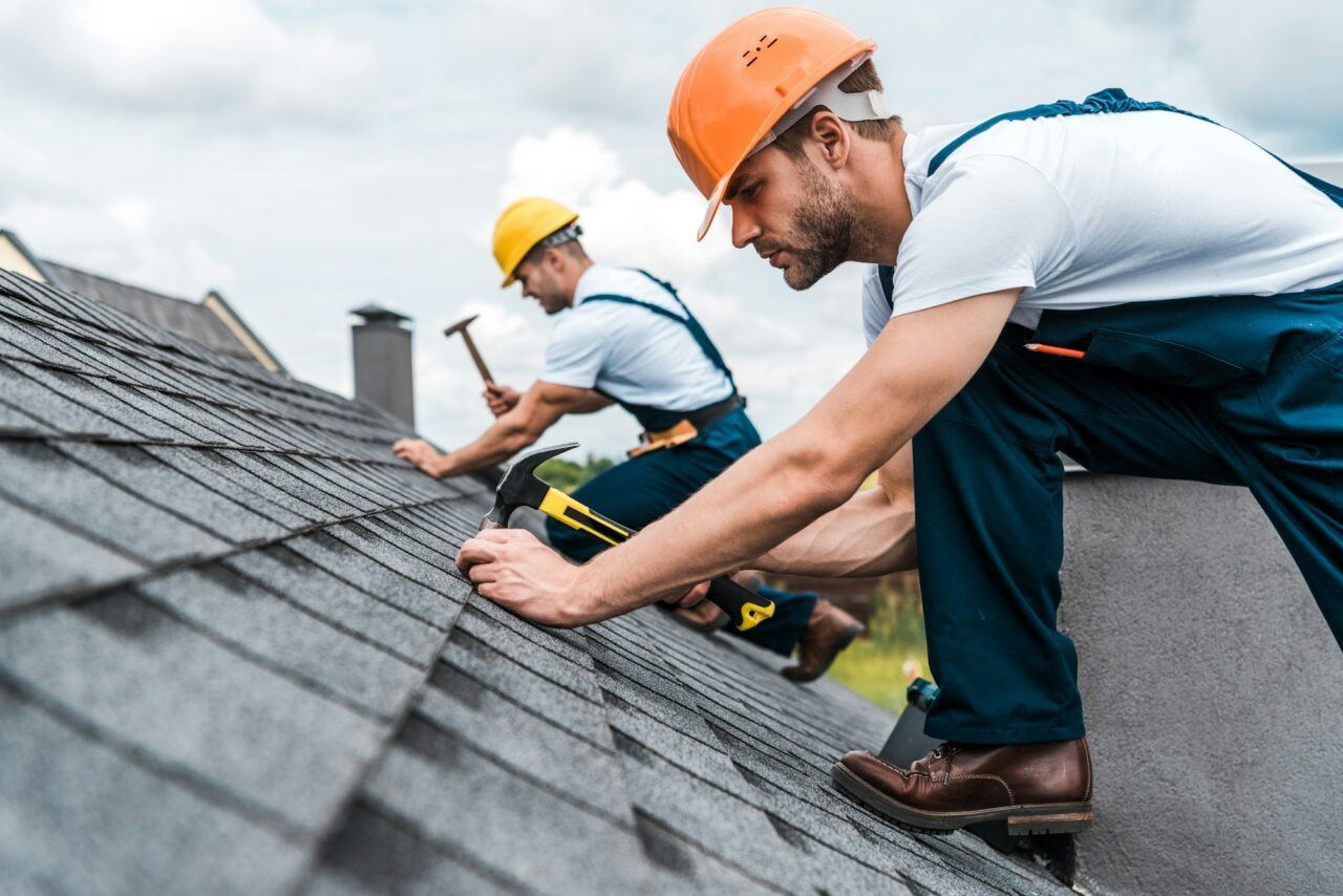 Apex Roofing Solutions crew working on a residential roof